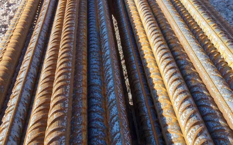 Close view of ribbed deformed reinforcement bars stacked together